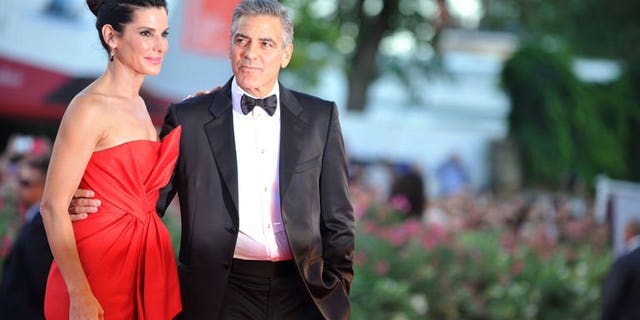 US actor George Clooney and US actress Sandra Bullock arrive for the opening ceremony of the 70th Venice Film Festival and the screening of the movie "Gravity" presented out of competition, on August 28, 2013.