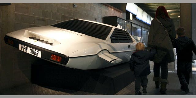 A family walks past the Lotus Esprit underwater car from the James Bond film "The Spy Who Loved Me" at the Beaulieu National Motor Museum on January 15, 2012.