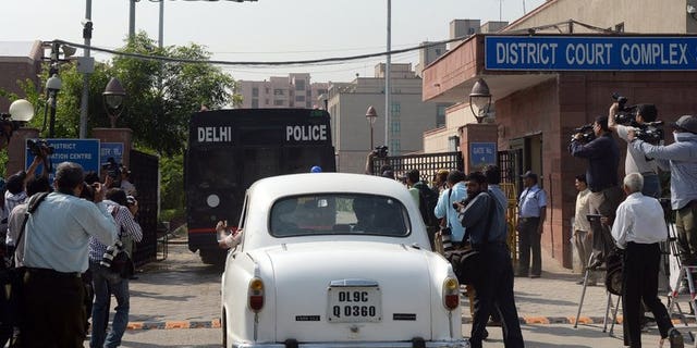 A Delhi police van believed to be carrying the accused in a gang rape case enters the court complex on September 10, 2013. All four defendants were found guilty of the gang rape and murder of a student on a New Delhi bus.