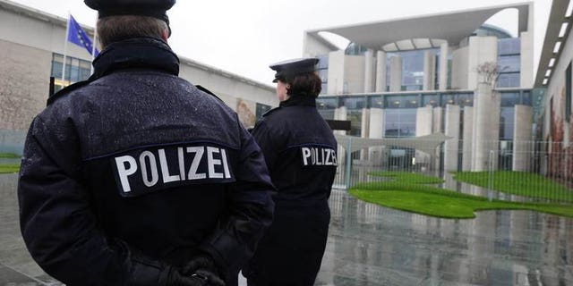 German police officers patrol in front of the Chancellery in Berlin on November 18, 2010. German police have arrested a man over an alleged far-right plot to use explosives mounted on a model airplane against political opponents, authorities said Tuesday.