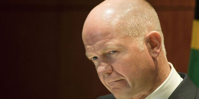 Foreign Secretary William Hague gives a press conference on September 10, 2013, in Cape Town. Britain would back any "credible" UN Security Council resolution on Syria's chemical weapons programme, but it must contain the threat of force, Hague said.