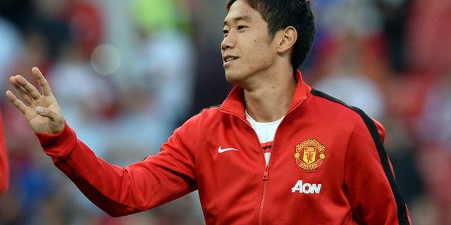 Shinji Kagawa warms up ahead of Manchester United's game against Chelsea at Old Trafford on August 26. Kagawa voiced frustration at being sidelined by new Manchester United manager David Moyes after scoring a cracker in his country's 3-1 win over Ghana on Tuesday.
