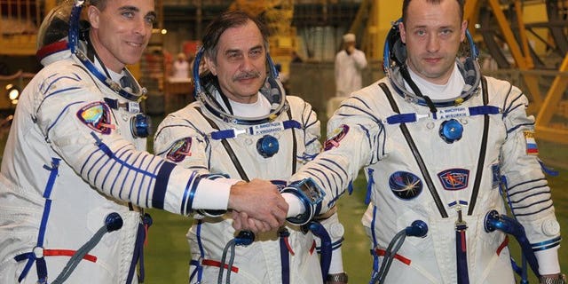 Russian cosmonauts, Pavel Vinogradov (C), Alexander Misurkin (R), and US astronaut Christopher Cassidy during training at Kazakhstan's Baikonur cosmodrome on March 17, 2013. The three returned to Earth Wednesday on board a Russian Soyuz capsule after a half-year mission on the International Space Station (ISS), landing in Kazakhstan, mission control in Moscow announced.
