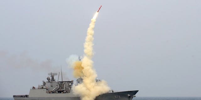 The South test launches a cruise missile in a picture released February 14, 2013. Seoul said Wednesday it would show off a missile capable of striking the North's command headquarters.