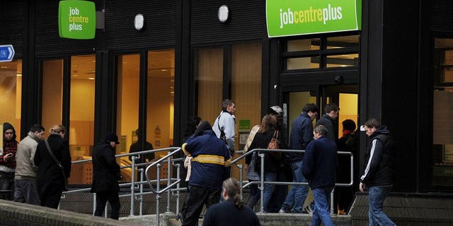 People enter a job centre in Bromley on January 20, 2010. Britain's unemployment rate eased to 7.7 percent in the three months to July, official data showed.