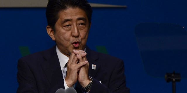Japan's Prime Minister Shinzo Abe, pictured in Buenos Aires on September 7, 2013. Abe intends to raise sales tax to 8.0 percent next year, from the current rate of 5.0 percent.