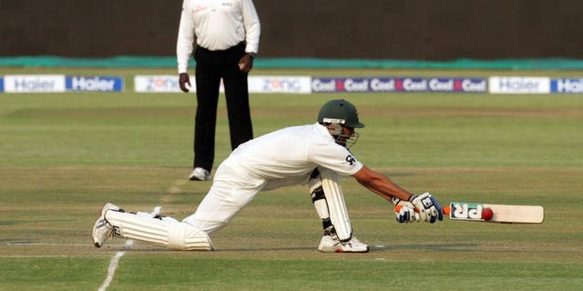 Pakistan batsman Younis Khan executes a reverse sweep shot during the second day of the second test match between Pakistan and hosts Zimbabwe at the Harare Sports Club on September 11, 2013. Pakistan were 211 for five at lunch, still 83 runs behind Zimbabwe's first innings total of 294, with Younis unbeaten on 76.