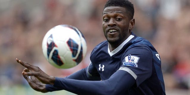 Tottenham Hotspur's Togolese striker Emmanuel Adebayor eyes the ball during the Premier League match against Stoke City in Stoke on Trent, central England, on May 12, 2013. Tottenham Hotspur manager Andre Villas-Boas revealed on Thursday that he has asked Togolese striker Emmanuel Adebayor to train with the Premier League club's reserve team.