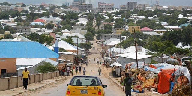 A taxi drives in Mogadishu on May 29, 2013. The forced eviction of thousands of Somalia's poorest from makeshift camps amid rebuilding efforts in the war-ravaged capital Mogadishu has led to "large scale" rights abuses, Amnesty International warned Friday.