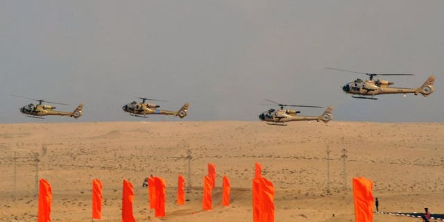 Egyptian military helicopters display military maneuvers in eastern Sinai on October 18, 2012, in a photo released by the Egyptian president's office. Egyptian military helicopters on Friday carried out air strikes on Islamist militant positions in Sinai, two days after suicide bombers killed six soldiers in the restive peninsula, security sources said.