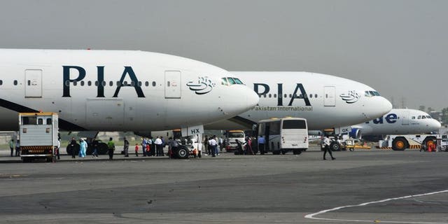 Pakistan International Airline planes at the Benazir Bhutto Airport in Islamabad. Pakistan's new prime minister plans to sell off a 26 percent stake in ailing national carrier PIA and hand over management control in a bid to stem haemorrhaging losses.