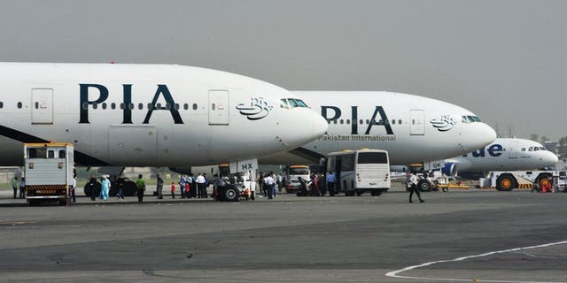 Pakistan International Airline planes at the Benazir Bhutto Airport in Islamabad. Pakistan's new prime minister plans to sell off a 26 percent stake in ailing national carrier PIA and hand over management control in a bid to stem haemorrhaging losses.
