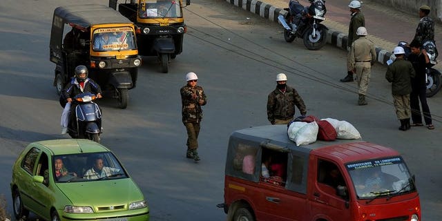 File picture shows a police checkpoint in Imphal in the northeastern Indian state of Manipur. A powerful bomb blast in a busy area on the outskirts of Imphal has killed nine labourers and injured about 21 other people, police said Saturday.