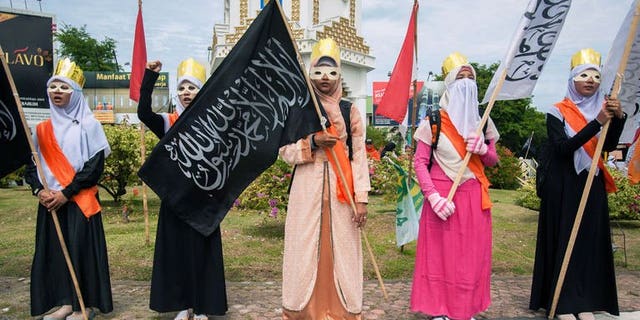 Muslim women stage a protest against the Miss World beauty pageant contest in Banda Aceh, northern Sumatra island, on September 14, 2013. The Miss World beauty contest, which has attracted fierce opposition by hardline Islamic groups in Indonesia, is now facing another challenge -- a rival pageant exclusively for Muslims.
