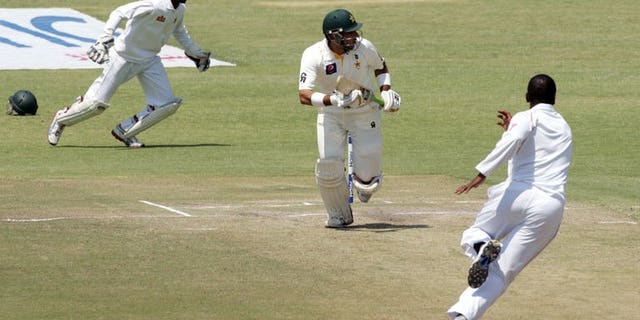 Pakistan's captain Misbah-Ul-Haq (centre) runs during the second Test match against Zimbabwe in Harare on September 14, 2013. Misbah hit his third half-century of the series, but his team lost three wickets on a tense fifth day of the second Test.