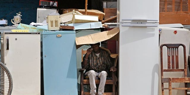 Used refrigerators are displayed for sale. Three South African children were found dead by a grandparent after becoming stuck in an abandoned refrigerator as they played near their home, police have said.