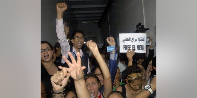 Tunisian journalists protest against the detention of Zied el-Heni, a Tunisian journalist, on September 13, 2013. Tunisian public prosecutor Tarek Chkioua, under fire for pursuing cases against journalists, has been promoted to the country's Court of Appeal, a justice ministry list shows.
