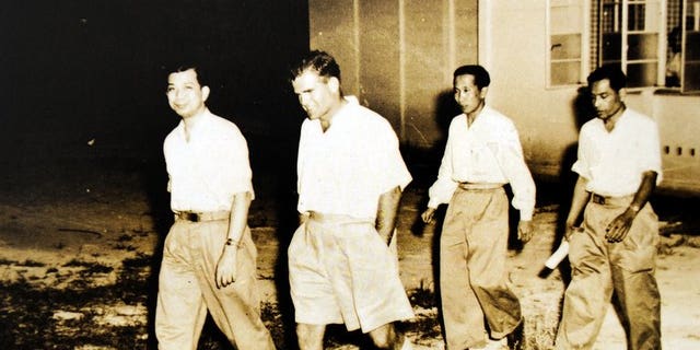 This photo taken in 1955 and received from the National Archives of Malaysia shows the former communist leader Chin Peng (left) during negotiations with the Malaysian government in Kuala Kubu Bharu. Chin Peng -- who led a guerrilla campaign against British colonial rule -- has died in exile in Thailand, according to his military liaison.