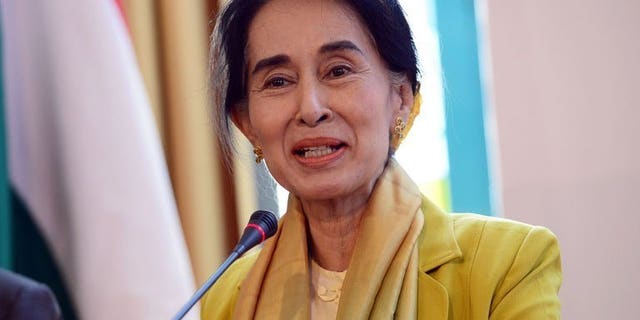 Myanmar's opposition leader Aung San Suu Kyi answers a question during a press conference in Budapest, on September 13, 2013. Suu Kyi has risked prompting Chinese anger after it was confirmed she had a private meeting with the Dalai Lama on the sidelines of a Prague rights conference.