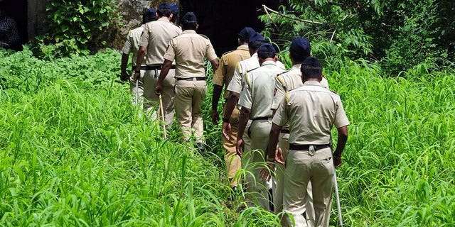 Indian policemen on patrol in Mumbai, on August 28, 2013. Indian police are interrogating a school bus cleaner after his arrest on suspicion of raping a four-year-old in the vehicle on the outskirts of Mumbai earlier this month.