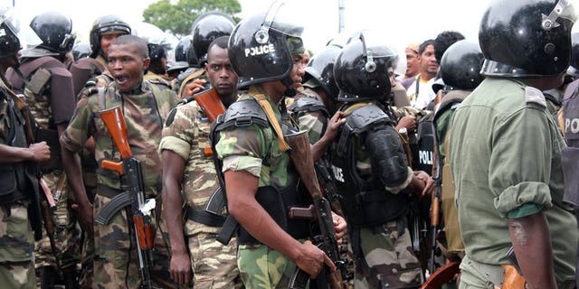 Police stand guard in Antananarivo on January 21, 2012. Madagascar police said a bomb blast killed one person in the capital Antananarivo Monday, amid heightened political tensions in the island nation.