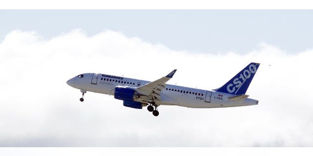 The new Bombardier aircraft CS100 is shown in Mirabel, Quebec after taking off for the first time on September 16, 2013.
