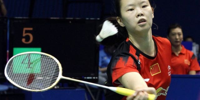 World number-one Li Xuerui, shown September 14, 2013, has pulled out of the badminton Japan Open because of a sore knee, with her teammate linking the problem to a jam-packed schedule for Chinese players.
