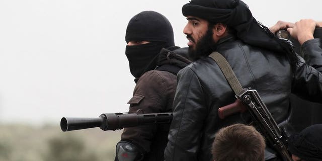 Fighters with the Al-Qaeda-linked Al-Nusra Front in the Syrian village of Aziza, on April 4, 2013. A military tribunal in Jordan has jailed six Muslim extremists for trying to join the Al-Nusra Front to fight against Syrian President Bashar al-Assad's forces.
