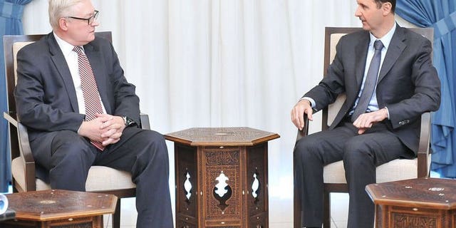 Russian Deputy Foreign Minister Sergei Ryabkov, left, meeting with Syrian President Bashar al-Assad in Damascus.