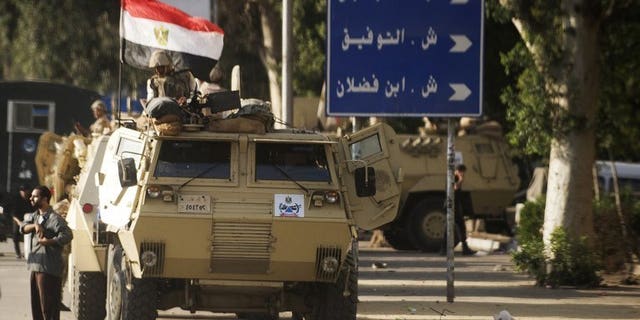 Egyptian troops and police stormed the village of Kerdassah near Cairo Thursday in the latest crackdown on militants. File picture shows Egyptian troops in Cairo on September 3, 2013.
