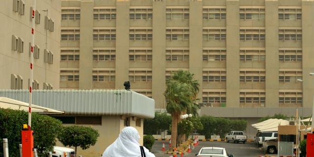 A Saudi nurse walks towards the King Fahad hospital in the city of Hofuf on June 16. Two Saudis have died after contracting the MERS coronavirus, the health ministry said on Thursday, bringing the total number of fatalities from the SARS-like virus in the kingdom to 49.