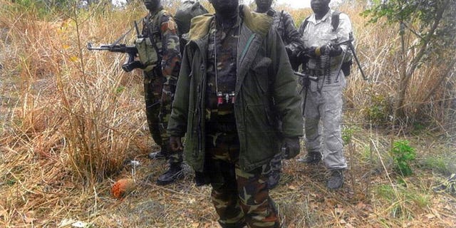 An undated handout photo released by the Central African People's Democratic Front (FDPC) shows their leader Abdoulaye Miskine standing with fighters in Biti. Police in Cameroon have arrested a rebel leader from neighbouring Central African Republic, Miskine, suspecting that he might launch cross-border raids.