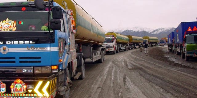 A convoy of NATO supply trucks prepares to cross into Afghanistan at the border town of Chaman on January 14, 2009. Pakistani security officials said Thursday they had arrested 12 members of a gang involved in torching and destroying shipments for NATO troops in Afghanistan.