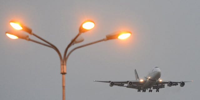 A Pakistan International Airlines (PIA) plane prepares to land in Islamabad on September 13, 2013. A pilot believed to be working for the airline has been arrested at a British airport on suspicion of being drunk in charge of a plane, police said.