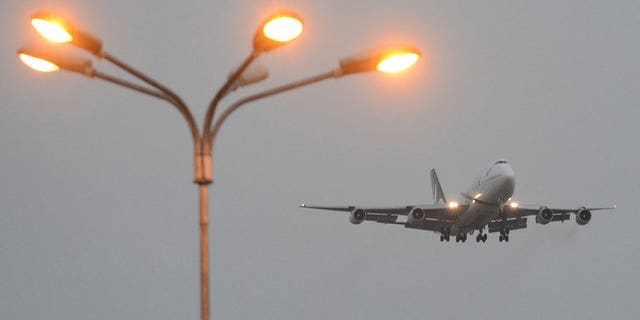 A Pakistan International Airlines (PIA) plane prepares to land in Islamabad on September 13, 2013. A pilot believed to be working for the airline has been arrested at a British airport on suspicion of being drunk in charge of a plane, police said.