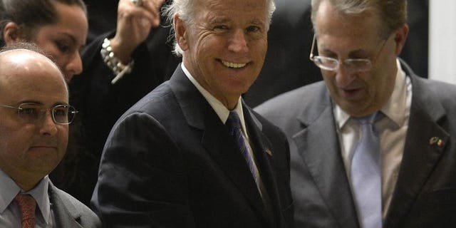 US Vice President Joe Biden (C) arrives at the Benito Juarez international airport in Mexico City, on September 19, 2013 for a one-day official visit.
