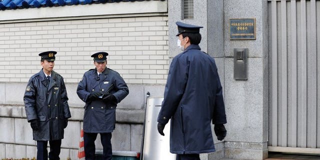 File picture shows policemen in Tokyo on December 19, 2011. Seven people who allegedly dissolved the body of a gigolo-club owner using chemicals found in drain cleaner have been arrested by Japanese police, officials and media reports said Friday.
