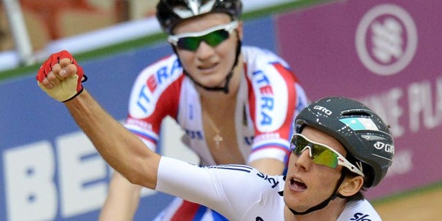 Britain's Simon Yates (right) and Russia's Kirill Sveshnikov react after a UCI Track Cycling World Championships race in Minsk on February 22, 2013. Yates won the Tour of Britain's first 'mountain' stage as he crossed the line in front on Haytor Rocks in Dartmoor.