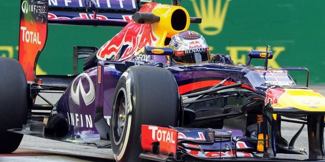 Red Bull driver Sebastian Vettel of Germany speeds around a corner during the first practice session of the Formula One Singapore Grand Prix on September 20, 2013. Vettel set a scorching pace as he dominated free practice at the Singapore Grand Prix in ominous style.