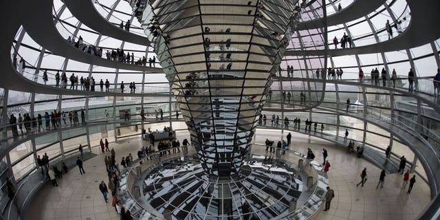 Visitors stand inside the cupola of the German Bundestag (lower house of parliament) in Berlin.