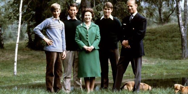 Queen Elizabeth and the Duke of Edinburgh (R) pose with their three sons, Charles, Edward (L), Andrew (2ndR) and the royal corgies in Balmoral Castle, Scotland, November 20, 1979.