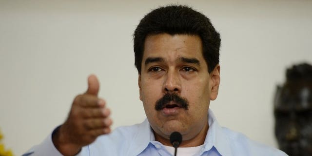 Venezuelan President Nicolas Maduro, pictured in Caracas on September 09, 2013, said he had arrived in Beijing on Saturday after accusing the United States of refusing his plane access to its airspace for the journey.