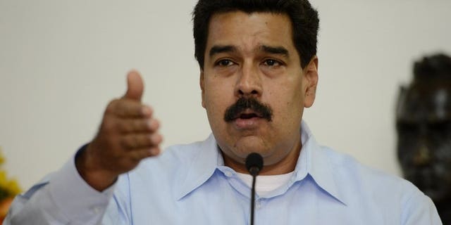 Venezuelan President Nicolas Maduro, pictured in Caracas on September 09, 2013, said he had arrived in Beijing on Saturday after accusing the United States of refusing his plane access to its airspace for the journey.