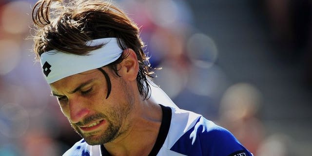 David Ferrer of Spain misses a shot against Richard Gasquet of France during their 2013 US Open men's singles quarterfinal match at the USTA Billie Jean King National Tennis Center September 4, 2013 in New York. Ferrer returns to Kuala Lumpur to headline the Malaysian Open, aiming to get back the winning feeling after an inconsistent year.
