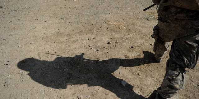 A US Soldier serving with the NATO-led mission in Afghanistan in Kandahar province on August 6, 2010. A man wearing Afghan security forces uniform shot dead three NATO-led soldiers on Saturday in the eastern part of the country, the coalition said.