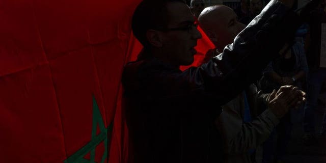 Dozens of people protest in front of Morocco ambassy, on September 21, 2013 in Paris, to call for the release of Ali Anouzla, a news website editor arrested on September 17 in Rabat after he posted an article about a jihadist video.