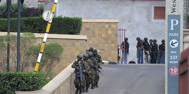 Military personel mobilise on September 21, 2013 outside an upmarket shopping mall in Nairobi.