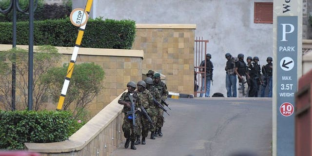 Military personel mobilise on September 21, 2013 outside an upmarket shopping mall in Nairobi.