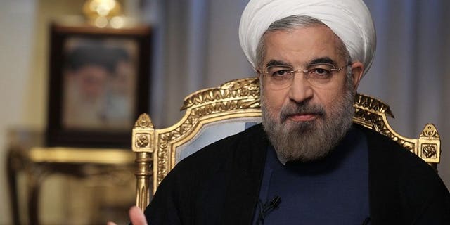 A handout picture released by the Iranian presidency shows Iranian President Hassan Rowhani attending an interview broadcast live on state television in Tehran on September 10, 2013.