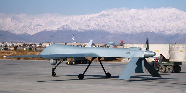 A US drone armed with a missile sets off from its hangar at Bagram Air Base in Afghanistan. At least six people were killed in a US drone strike on a militant compound in a northwestern Pakistani tribal area, security officials have told AFP.